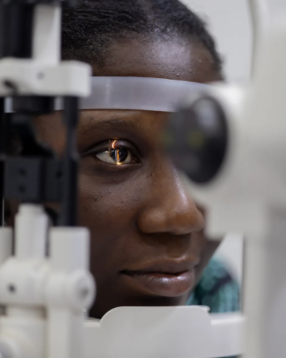 Close-up of a slit-lamp eye-health assessment at Lead Opticals in Oyarifa, Accra