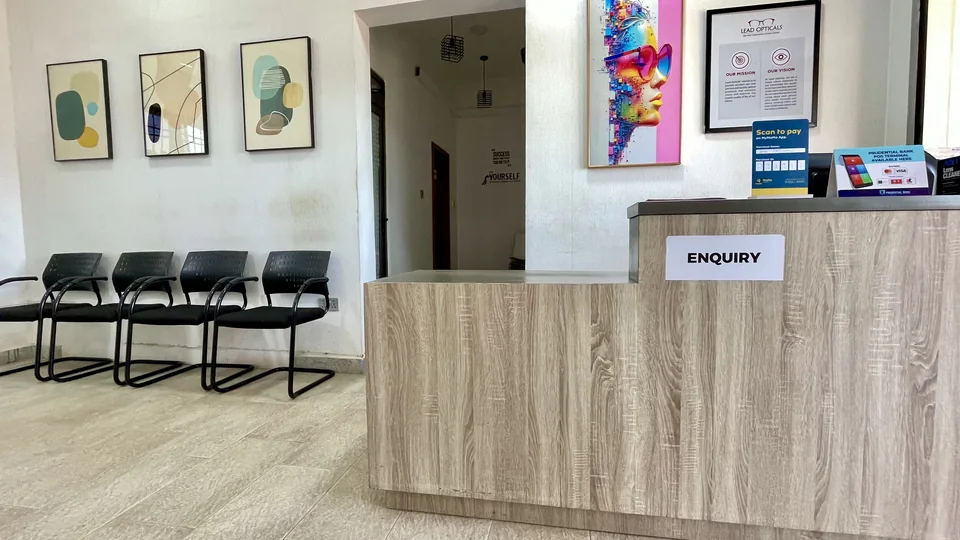 Reception desk and waiting chairs at Lead Opticals in Oyarifa, Accra