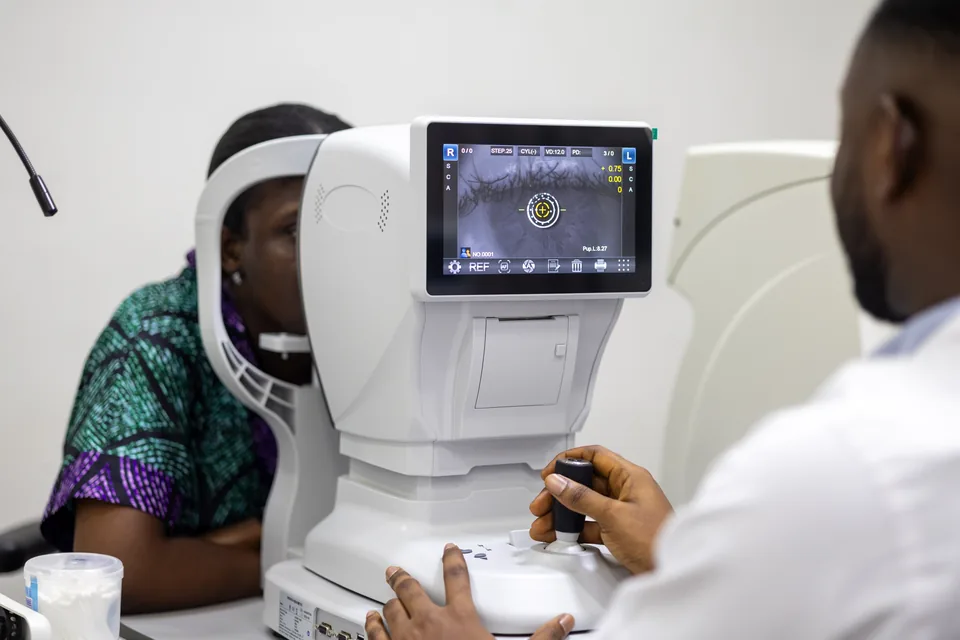 Autorefractor measurement during refraction testing at Lead Opticals in Oyarifa, Accra